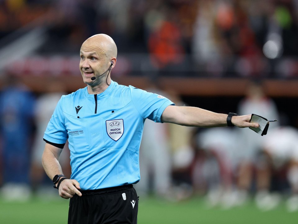 Terrified ref Anthony Taylor mobbed by furious Roma fans in airport before police steam in after Europa controversy