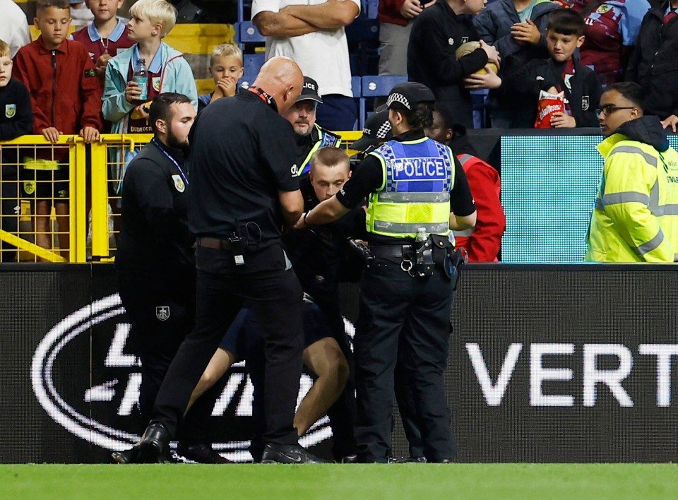 Burnley vs Man City in big security breach as pitch invader charges at Julian Alvarez