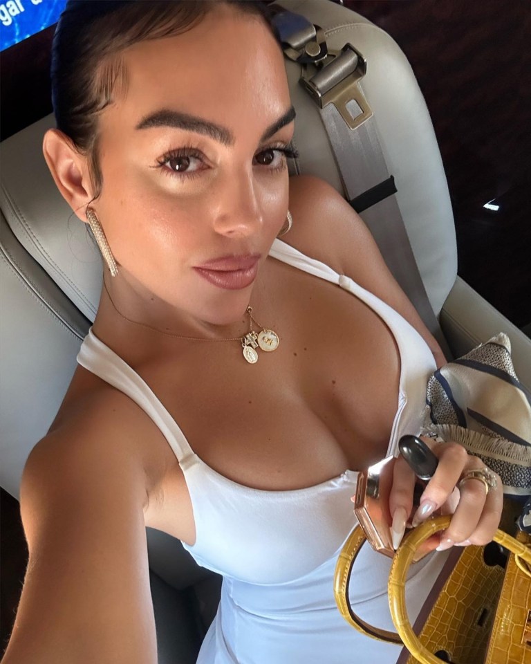 Inside Georgina Rodriguez’s private jet as Cristiano Ronaldo’s girlfriend puts on busty display in short white dress