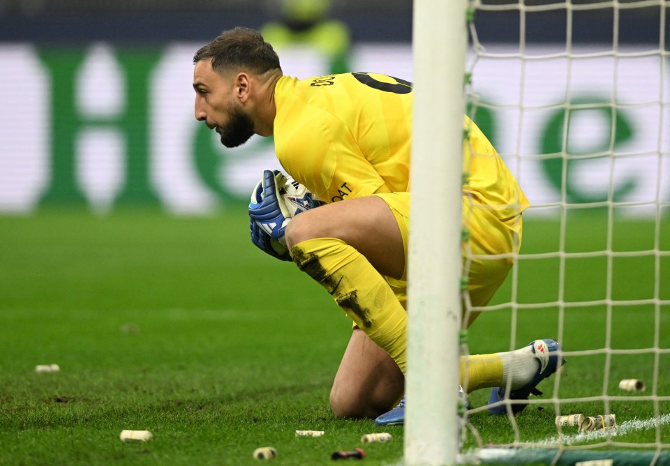 Incredible moment ‘betrayed’ AC Milan fans shower former keeper Donnarumma with fake BANK NOTES after PSG transfer