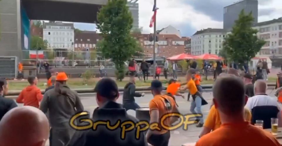 Shocking footage shows Holland fans fighting EACH OTHER in huge street brawl at Euro 2024 before riot police intervene