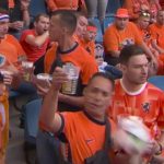 Watch unfortunate moment Dutch fan is hit flush in the face by football as he poses for cameras – and drops his beer