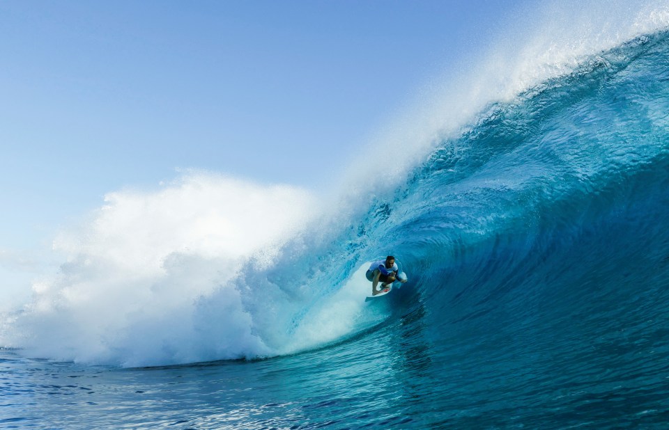 Why is surfing at the Paris 2024 Olympics taking place in Tahiti?