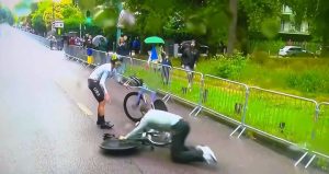 Shocking moment Olympics cyclist crashes three times in rainy Paris… before team mechanic gets in on act
