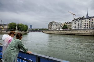River Seine passes health tests for triathlon and swimming, but weather forecast could spell disaster for Paris Olympics