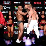 Mike Tyson SLAPS Jake Paul before being pulled apart by security in chaotic weigh in before controversial Netflix fight