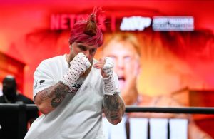 Jake Paul shows off dramatic new look by wearing ROOSTER hat in open workout for Mike Tyson fight