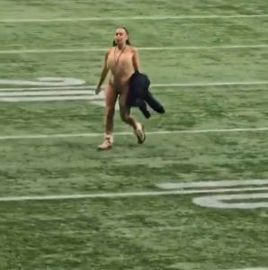 Woman who went viral for stripping naked and streaking during Grey Cup slapped with stadium BAN