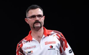 ‘Can we do the draw again please,’ asks darts star Damon Heta after learning World Championship fate