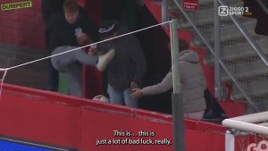 Excruciating moment fan kicks his mate’s beer out of his hands on live TV at Europa League clash