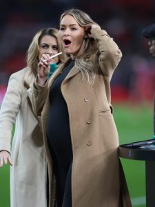 Laura Woods shows off blossoming baby bump at Wembley as ITV host presents England Lionesses draw with United States