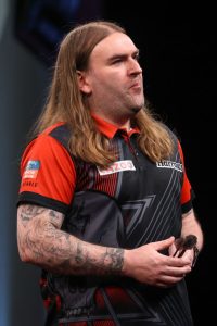 Who is English darts star Ryan Searle?