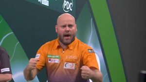 Former world darts champion, 38, TREBLES yearly earnings with first nine-darter of PDC World Championships